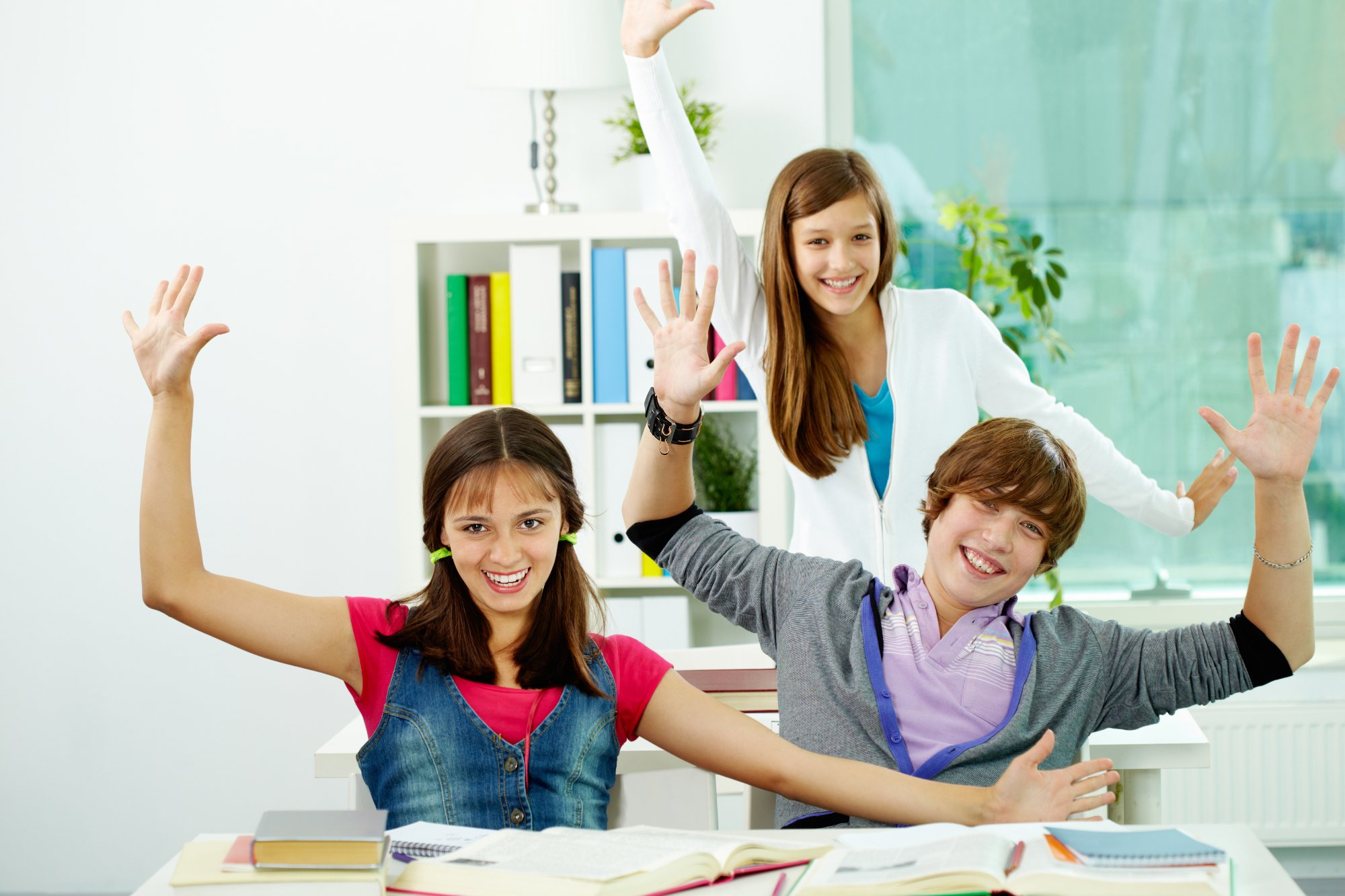 Positive teens playing and celebrating